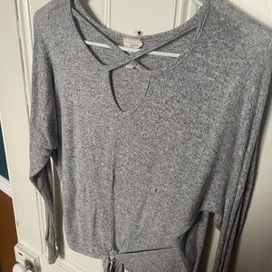 gray long sleeve with intricate neck cut-out